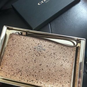 Coach small glitter wristlet ✨gold stars